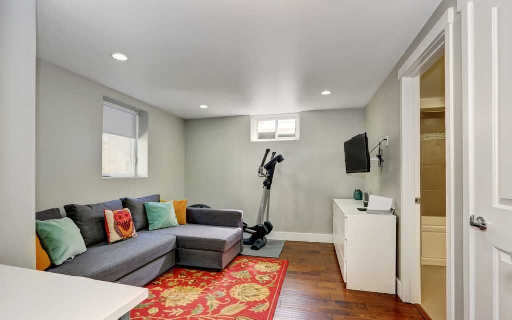 Sitting Room Interior With Sport Equipment In The Basement
